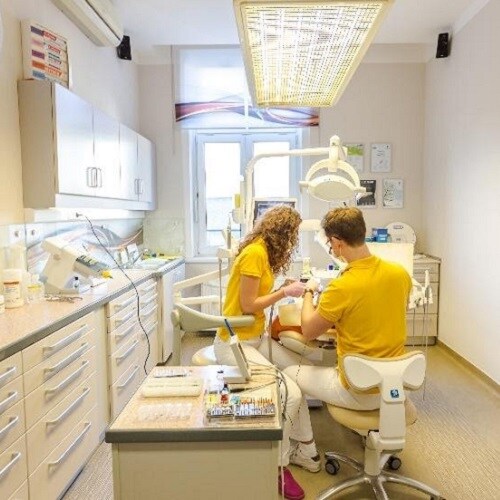 dentist examining a patient in the surgery
